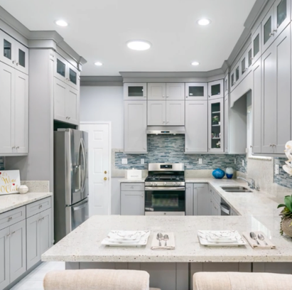 Exterior home remodel with new stucco finish and modern light fixtures in Wildomar